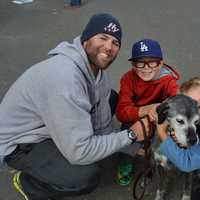 <p>Visitors at the Fall Festival last month take some time to meet a DAWS pet.</p>