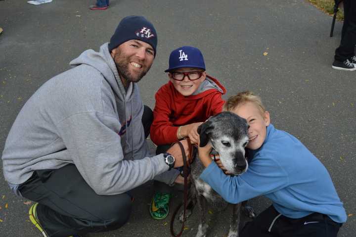 Visitors at the Fall Festival last month take some time to meet a DAWS pet.