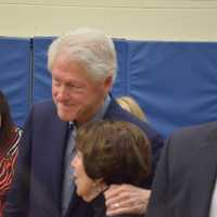 <p>Former President Bill Clinton embraces as supporter while he and his wife, Democratic presidential candidate Hillary Clinton, visiting their polling place in Chappaqua to vote in the New York Democratic primary.</p>