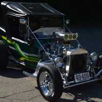 <p>Vintage cars are lined up throughout the parking lot.</p>