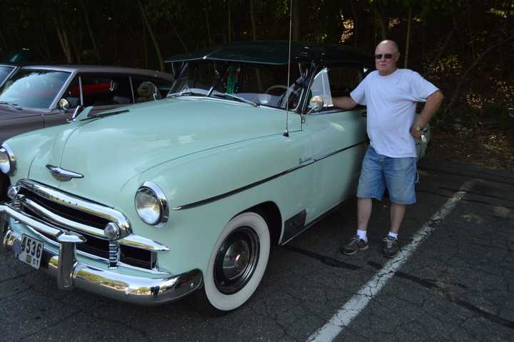 Wally Anderson of Southington, stands beside his 1950 Chevy.