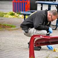 <p>A detective from the Passaic County Sheriff&#x27;s Crime Scene Investigations unit collects evidence.</p>