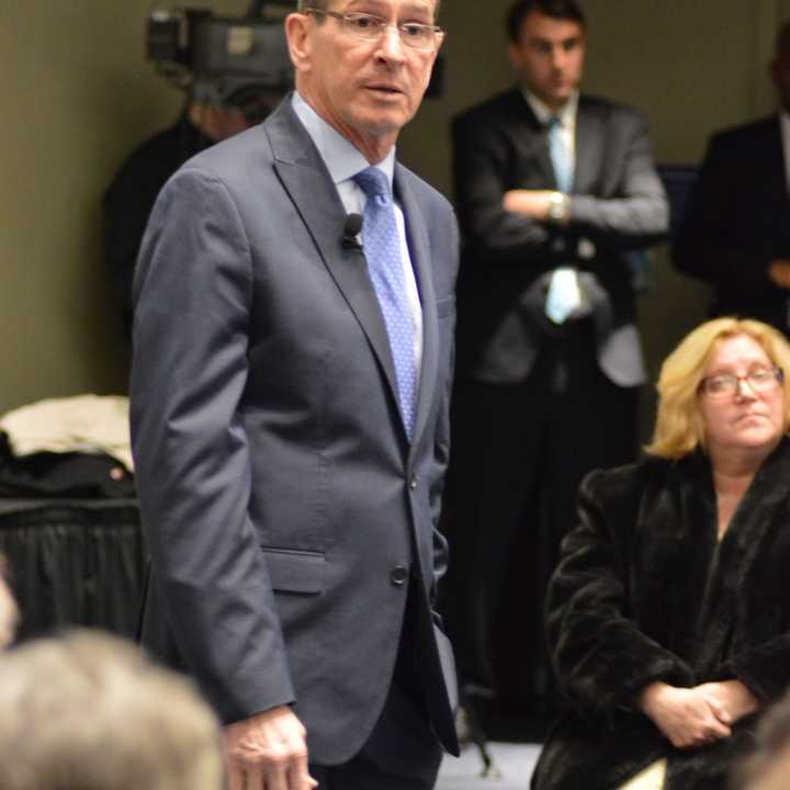 Gov. Dannel Malloy addresses the audience in a town hall forum at the Gen Re Auditorium at the  UConn-Stamford Campus on Thursday evening.