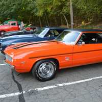 <p>A red Dodge Charger is one of the stars of the show.</p>