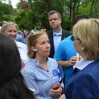 <p>Hillary Clinton meets with a supporter in Chappaqua moments prior to the start of the 2016 Memorial Day parade.</p>