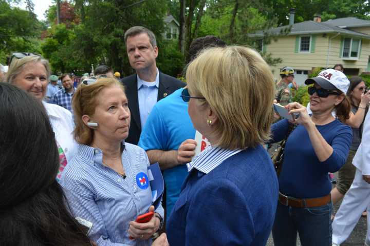 Hillary Clinton meets with a supporter in Chappaqua moments prior to the start of the 2016 Memorial Day parade.