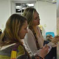 <p>Left to right: Sita Watanabe and Morgan Katsch work on a new mural in the children&#x27;s studio at the Katonah Art Center&#x27;s new home in Goldens Bridge.</p>