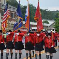 <p>A color guard of band marchers joins the Mahopac Volunteer Fire Department&#x27;s dress parade.</p>