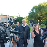 <p>Christopher Schraufnagel and his attorney, Stacey Richman, are surrounded by a media scrum as they leave New Castle Justice Court in downtown Chappaqua.</p>