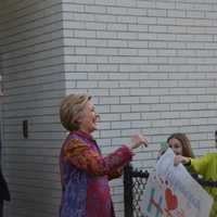 <p>Hillary Clinton meets a crowd of supporters after casting her Democratic presidential primary ballot in Chappaqua. Bill Clinton is pictured at left.</p>