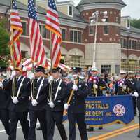 <p>Mahopac Falls firefighters march in the Mahopac Volunteer Fire Department&#x27;s dress parade.</p>