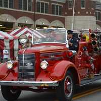 <p>An antique Mahopac Falls firetruck is driven at the Mahopac Volunteer Fire Department&#x27;s dress parade.</p>