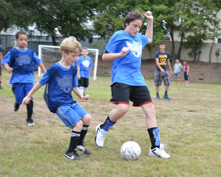 Athletes scrimmage against each other during today&#x27;s Saddle Brook Angels season opener.