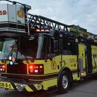 <p>A yellow Carmel firetruck is driven at the Mahopac Volunteer Fire Department&#x27;s dress parade.</p>