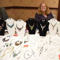 <p>Another vendor shows off an array of jewelry choices — always a favorite gift for the holidays.</p>