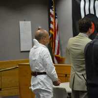 <p>Hengjun Chao, left, is pictured at his arraignment in New Castle Justice Court.</p>