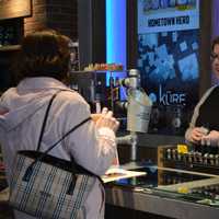 <p>Kure General Manager Tasha Rocheleau talks to a customer at Bridgeport&#x27;s Kure.</p>