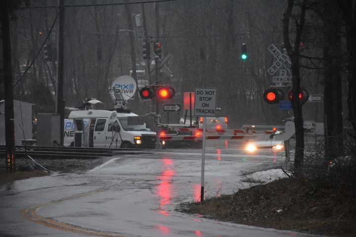 Broadcast journalists were present Wednesday afternoon at the Commerce Street crossing in Valhalla on the one-year anniversary of the deadly collision. A news truck is pictured in the distance.