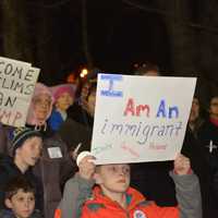 <p>Demonstrators at an interfaith vigil in Chappaqua protest President Donald Trump's ban on admitting refugees.</p>
