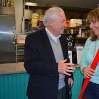 <p>Fairfield First Selectman Michael Tetreau shares a laugh with D. LIsh &amp; Co. owner Alicia Connelly.</p>