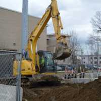 <p>Workers prepare for a new microgrid generator for some Bridgeport buildings, including City Hall.</p>