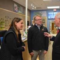 <p>Fairfield First Selectman Michael Tetreau, right, chats with Sue Shunta and Chris Petherick in their new Wild Birds Unlimited Nature Shop.</p>