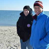 <p>Some in the crowd stay bundled up at the Polar Plunge.</p>