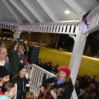 <p>Cantor Star Trompeter of Temple Beth El of Northern Westchester, a synagogue that is located in Chappaqua, leads a song at an interfaith vigil. The event was held as a protest of President Donald Trump's ban on admitting refugees.</p>