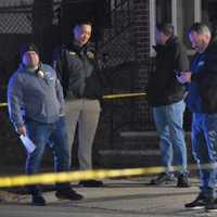 <p>Detectives gather following the Feb. 11 robbery at the Delta gas station at 96 West Main Street in Bergenfield</p>