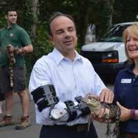 <p>Bridgeport Mayor Joe Ganim makes a reptilian friend at Beardsley Zoo. (Ganim recently had arm surgery.)</p>