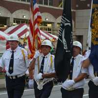 <p>Members of an American Legion post march in the Mahopac Volunteer Fire Department&#x27;s dress parade.</p>