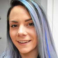 <p>Industrie Stylist Kelsey Grycan of Westwood gets way into the spirit of the blue hair extension fundraiser.</p>