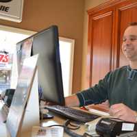 <p>Ari Manetas works the front desk at Anita Discount Tire and Auto in River Vale.</p>