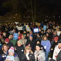 <p>Demonstrators at a Chappaqua interfaith vigil hold candles. The vigil was held to protest President Donald Trump's ban on admitting refugees into the country.</p>