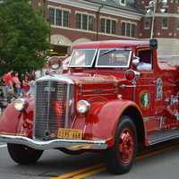 <p>An antique Croton Falls firetruck is driven in the Mahopac Volunteer Fire Department&#x27;s dress parade.</p>