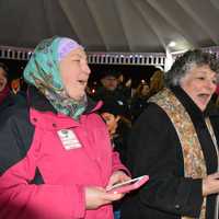 <p>An interfaith group of attendees sings at a vigil in Chappaqua, which was held to protest President Donald Trump's ban on admitting refugees.</p>