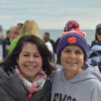 <p>Angela Swift (right) has been a regular participant in the Old Greenwich on New Year&#x27;s Day Dip at Tod&#x27;s Point for many years. She also came up with the idea of selling T-shirts to benefit Kids in Crisis.</p>