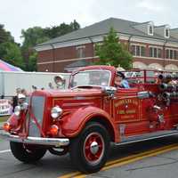 <p>An antique Mohegan Lake firetruck is driven in the Mahopac Volunteer Fire Department&#x27;s dress parade.</p>