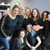 <p>The staff of Industrie Hair Gurus in Ridgewood, hosts of the blue hair extension fundraiser for International Childhood Cancer Awareness Day.</p>