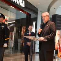 <p>Father John McCrone closes the event alongside Bergen County Police Chiefs Association President Joseph Rutigliano, at right.</p>