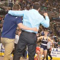 <p>Paramus coaches celebrate as Kyle Cochran comes out of the NJSIAA semifinal round victorious.</p>