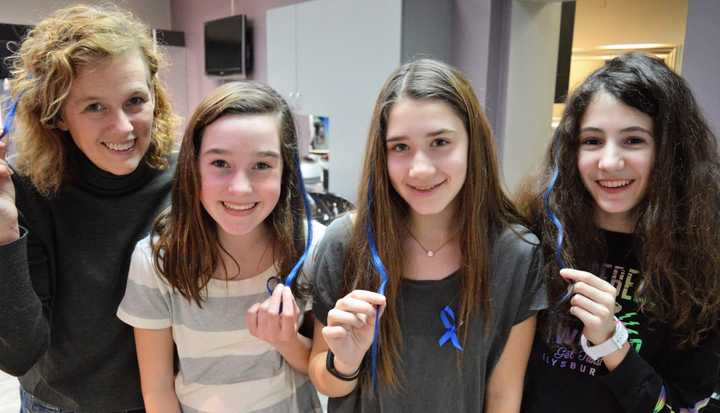 Sporting their blue hair extensions at Industrie Hair Gurus in Ridgewood are, from the left, Sandy Santangelo, mom; Samantha Santangelo, 12; Rebecca Kaye, 12, and Ella Dusci, 12.