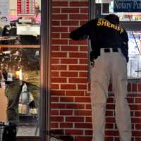 <p>Bergen County Sheriff&#x27;s BCI detective gathers evidence at Hudson Drug at 48 Union Avenue in Cresskill.</p>