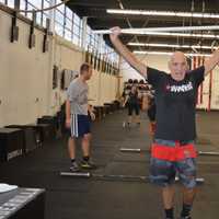 <p>Guerrilla Fitness Paramus owner Joe Ghaznavi guides Wilcomes during lunges.</p>