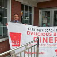 <p>Daily Voice Director of Media Initiatives/Managing Editor Joe Lombardi, left, presents winning banner to Coach Diner owner Nick Karkambasis.</p>