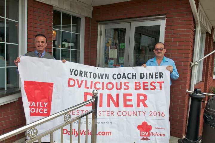 Daily Voice Director of Media Initiatives/Managing Editor Joe Lombardi, left, presents winning banner to Coach Diner owner Nick Karkambasis.