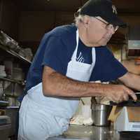 <p>Gary Barbarulo readies pizza for the dinner rush.</p>