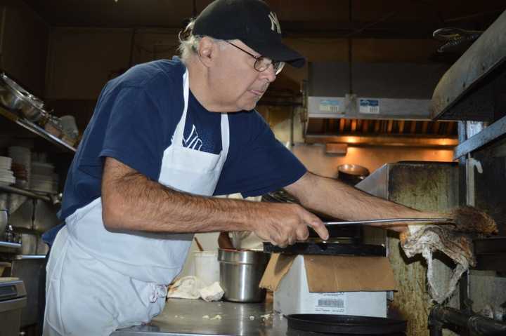 Gary Barbarulo readies pizza for the dinner rush.