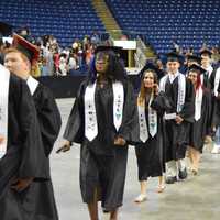 <p>The Class of 2016 from Fairchild Wheeler High marches into the Webster Bank Arena.</p>