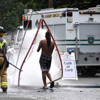 <p>One of the lake-goers who had to go through decontamination at Darlington Lake in Mahwah on Saturday, July 15.</p>